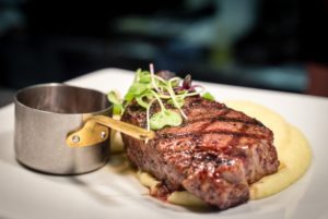 Steak on creamy mash and red wine jus